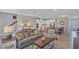 Spacious living room showcasing open floor plan to the kitchen, dining area and stairway at 7575 Sea Oak Ct, Parrish, FL 34219