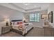 Relaxing main bedroom with tray ceiling, natural light, and comfortable furnishings at 7575 Sea Oak Ct, Parrish, FL 34219