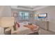 Comfortable main bedroom with neutral decor, and bright natural light at 7575 Sea Oak Ct, Parrish, FL 34219