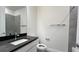 Modern bathroom featuring a sink, a mirror, and neutral finishes at 9270 Gulf Haven Dr, Parrish, FL 34219