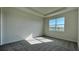 Neutral bedroom with carpet, natural light, and a tray ceiling at 9270 Gulf Haven Dr, Parrish, FL 34219