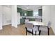 Eat in kitchen with olive green cabinets, stainless steel appliances, and stylish tile backsplash at 9608 Brave Buck Ave, Land O Lakes, FL 34638