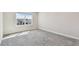 Light filled bedroom offers neutral paint and carpet at 11728 June Briar Loop, San Antonio, FL 33576