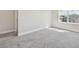 Bedroom with natural light, neutral paint, and comfortable carpet at 11728 June Briar Loop, San Antonio, FL 33576