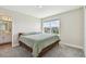 Serene bedroom featuring soft colors, a cozy bed with plush pillows, and ensuite bath at 11728 June Briar Loop, San Antonio, FL 33576