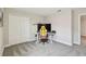 Bedroom features neutral paint, carpet, closet, and desk area at 11728 June Briar Loop, San Antonio, FL 33576