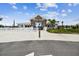 Welcoming community entrance featuring stylish architecture, lush landscaping, and a secure gated entry at 11728 June Briar Loop, San Antonio, FL 33576