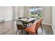 Inviting dining area with an ample natural light, showcasing elegant furnishings and decor at 11728 June Briar Loop, San Antonio, FL 33576