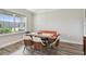 Dining room with modern table and chairs near a large window with natural light at 11728 June Briar Loop, San Antonio, FL 33576