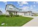 Well-maintained front yard showcases a lovely two-story home with a three-car garage in a desirable neighborhood at 11728 June Briar Loop, San Antonio, FL 33576