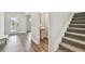 Foyer showcasing a stylish entry door, tiled floors, access to powder room and stairs at 11728 June Briar Loop, San Antonio, FL 33576