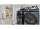 Convenient laundry room features modern appliances and ample storage space at 11728 June Briar Loop, San Antonio, FL 33576