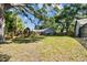 Spacious backyard featuring a wooden playset, ideal for children and outdoor fun at 17904 Singing Wood Pl, Lutz, FL 33548