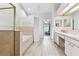 Bright bathroom featuring a shower, soaking tub and dual sink vanity at 17904 Singing Wood Pl, Lutz, FL 33548
