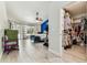 Bedroom with natural light, blue accent wall, walk-in closet, wood-look tile, and backyard views at 17904 Singing Wood Pl, Lutz, FL 33548
