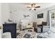 Charming Bedroom with whale wall decor, comfortable gray chair and ottoman, and neutral patterned rug at 17904 Singing Wood Pl, Lutz, FL 33548