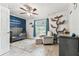 Inviting bedroom space with constellation theme wall, crib and cozy chair at 17904 Singing Wood Pl, Lutz, FL 33548