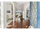 Spacious foyer with hardwood floors, arched doorways, and plenty of natural light at 17904 Singing Wood Pl, Lutz, FL 33548