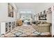 Comfortable living room with built-in shelving and a sliding glass door to the backyard at 17904 Singing Wood Pl, Lutz, FL 33548