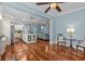 Open floorplan with hardwood floors, a modern kitchen, and a view of the living area at 14820 Potterton Cir, Hudson, FL 34667