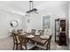 Bright dining area with ample seating, modern lighting, and a view of the outdoors at 3320 Prescott N St, St Petersburg, FL 33713