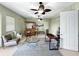 Cozy bonus room with a tiki bar, ceiling fans, and comfortable seating at 7020 Hawks Harbor Cir, Bradenton, FL 34207