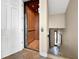 Home interior featuring an elevator with wood paneling and tile flooring at 7020 Hawks Harbor Cir, Bradenton, FL 34207
