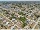 Wide aerial shot displaying the neighborhood, lakes, and community at 3067 Iverson St, Port Charlotte, FL 33952