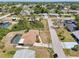 A beautiful aerial view of a house with a private pool in a quiet neighborhood at 3067 Iverson St, Port Charlotte, FL 33952