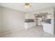 Eat-in kitchen with tiled floors, white cabinets, and modern appliances at 3067 Iverson St, Port Charlotte, FL 33952