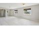 Cozy living room with tile flooring, natural light, and an open layout at 3067 Iverson St, Port Charlotte, FL 33952