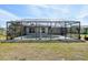 Relaxing screened-in pool with a lovely statue and plenty of space for entertaining at 3067 Iverson St, Port Charlotte, FL 33952