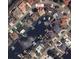 Aerial view of the neighborhood, surrounded by waterways, with the subject property marked in red at 802 Eagle Ln, Apollo Beach, FL 33572