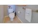 Well-maintained bathroom featuring a toilet, hand rail and decorative accents, exuding cleanliness and comfort at 802 Eagle Ln, Apollo Beach, FL 33572