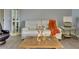 Cozy living room features a white sofa, decorative pillows, a wooden coffee table, and stylish accents at 802 Eagle Ln, Apollo Beach, FL 33572