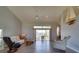 Bright living room with hardwood floors, high ceilings, slider to the lanai and water, and neutral walls at 802 Eagle Ln, Apollo Beach, FL 33572