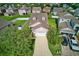 A picturesque aerial view showcases a well-maintained home with a lush green lawn and driveway at 4135 Rocky Fork Ter, Ellenton, FL 34222