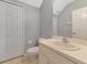 Neutral bathroom featuring a single sink vanity, ample storage, and standard toilet with necessary fixtures at 4135 Rocky Fork Ter, Ellenton, FL 34222