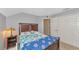 Serene bedroom featuring a full-size bed, dresser, and closet for storage, designed for a comfortable living space at 4135 Rocky Fork Ter, Ellenton, FL 34222