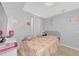 Bright bedroom with playful decor, a comfortable bed, and a functional desk area for or teens at 4135 Rocky Fork Ter, Ellenton, FL 34222