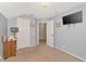 Bright bedroom with carpet, large closet, and gray walls at 4135 Rocky Fork Ter, Ellenton, FL 34222