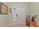 Inviting entryway featuring tiled floors, decorative wall art, and a charming wood table display at 4135 Rocky Fork Ter, Ellenton, FL 34222