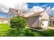 A charming home shows off its meticulously landscaped front yard with a full two-car garage at 4135 Rocky Fork Ter, Ellenton, FL 34222