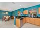 Open kitchen showcasing granite countertops, stainless steel appliances, and seamlessly connected dining area for entertaining at 4135 Rocky Fork Ter, Ellenton, FL 34222