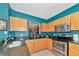 Updated kitchen featuring stainless steel appliances, granite countertops, and wooden cabinetry for a modern touch at 4135 Rocky Fork Ter, Ellenton, FL 34222
