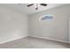 Simple bedroom with carpet floor and ceiling fan at 11344 Gallinule Ave, Weeki Wachee, FL 34613