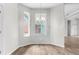 Bright dining area with chandelier, large windows, and a view of the pool at 11344 Gallinule Ave, Weeki Wachee, FL 34613
