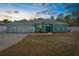 Charming home featuring a three car garage, manicured lawn, and a beautiful entrance at 11344 Gallinule Ave, Weeki Wachee, FL 34613
