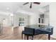 Living room with hardwood floors featuring a baby grand piano with a view of the pool at 11344 Gallinule Ave, Weeki Wachee, FL 34613