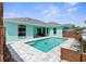 Refreshing backyard pool offering a serene outdoor retreat adjacent to a modern-style home at 11344 Gallinule Ave, Weeki Wachee, FL 34613